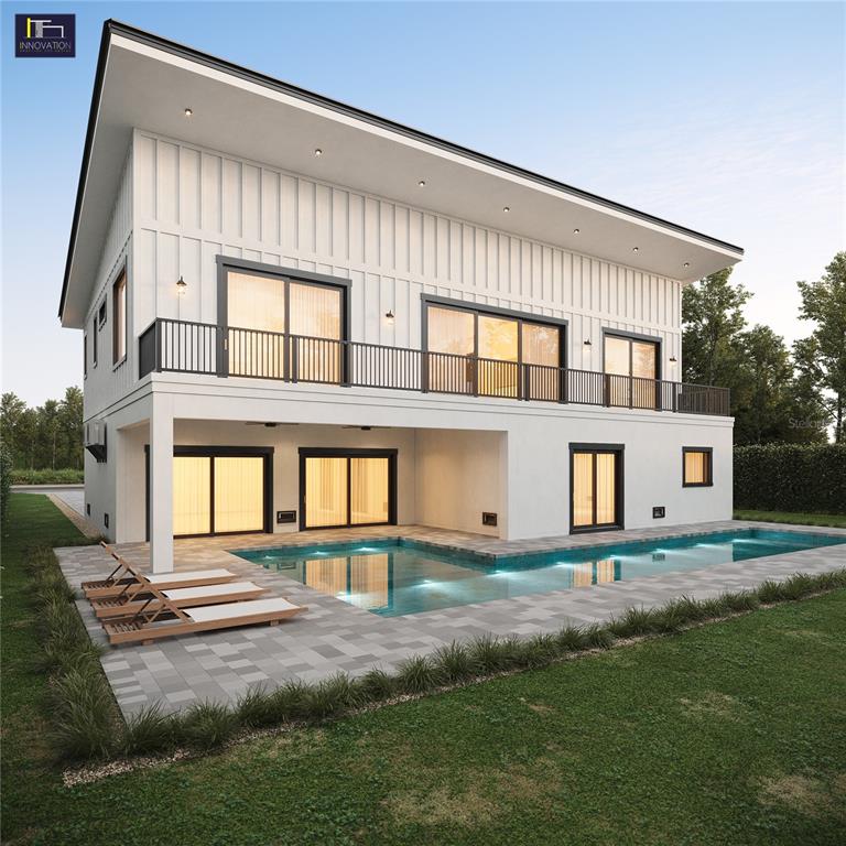 This is a rendering of a two-story modern house exterior with a pool and patio — 2560 BAYBREEZE STREET, ST JAMES CITY, FL