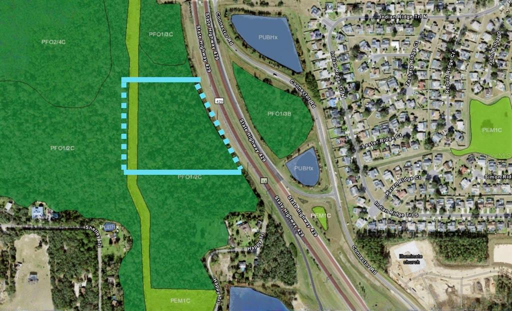 This is an aerial map showing a highlighted parcel of land adjacent to a highway — SHELLEY TRAIL, KISSIMMEE, FL