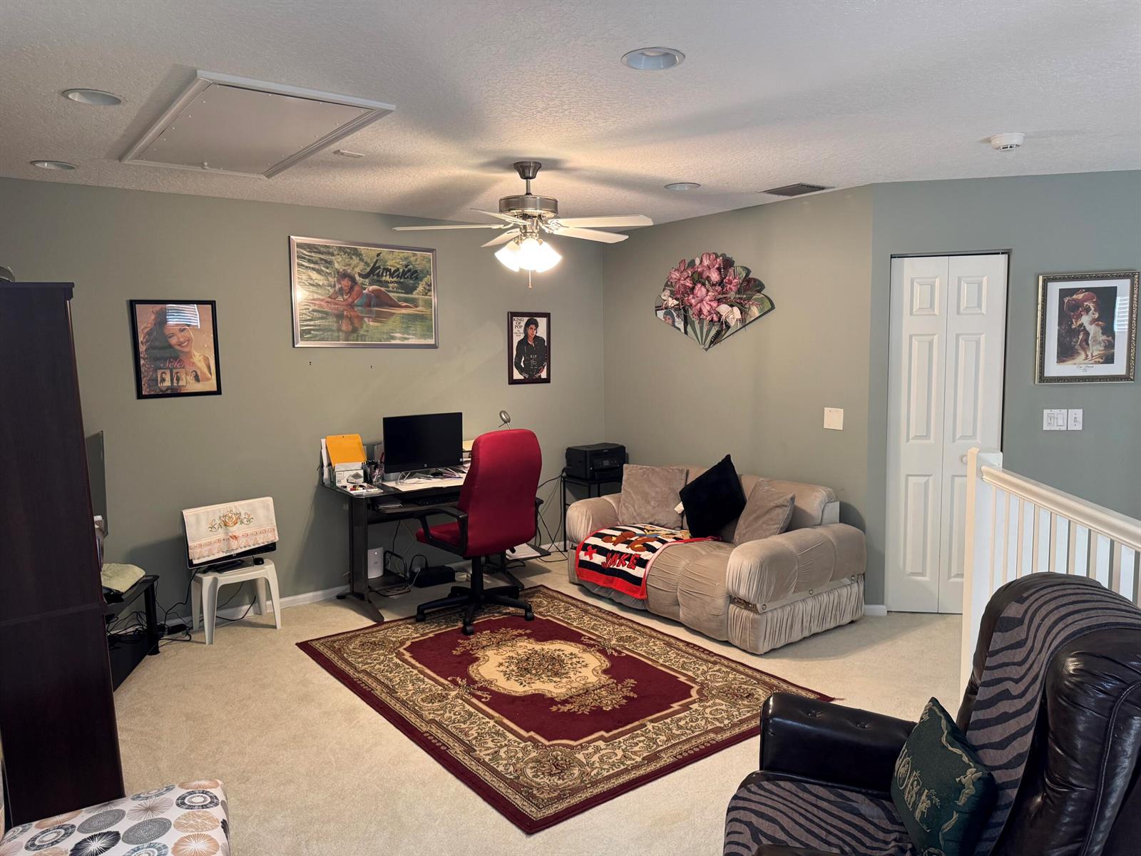 A home office features a desk, a red chair, a sofa, and a patterned area rug — 21196 Via Ventura # 21196, Boca Raton FL 33433, BOCA RATON, FL