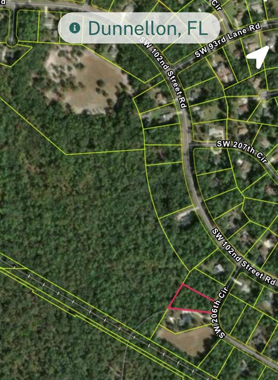 This is a satellite map view showing a highlighted vacant lot in a residential area — Lot 28 SW 206 CIRCLE, DUNNELLON, FL