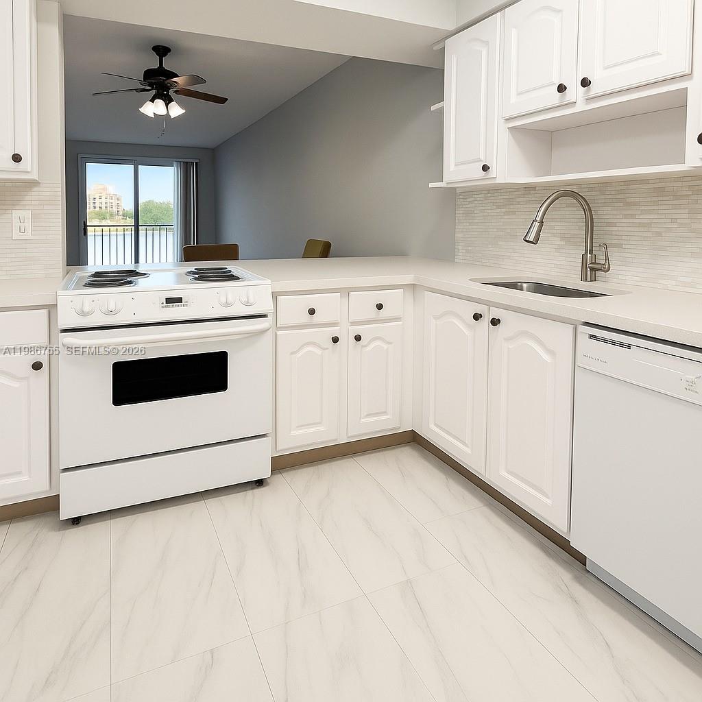 A white kitchen features a stove, dishwasher, sink, and marble-look tile flooring — 2900 N Course Dr # 107, Pompano Beach FL 33069, POMPANO BEACH, FL
