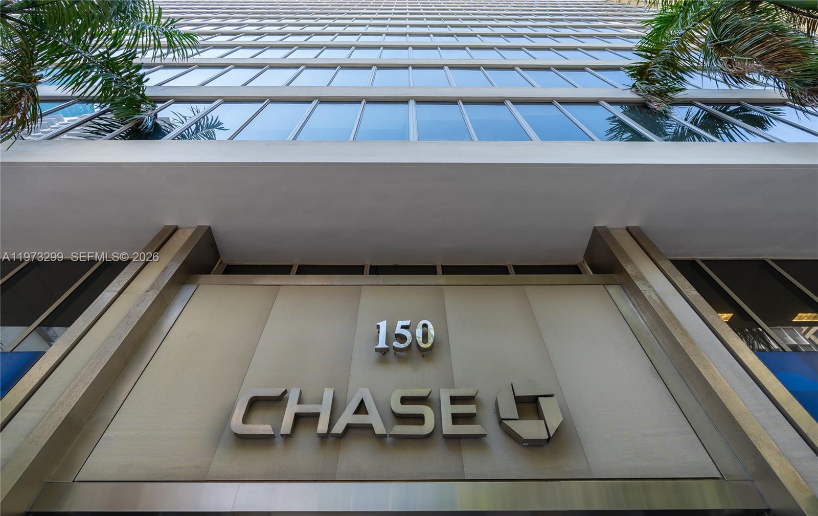 A low-angle view shows the exterior entrance of a building with Chase signage — 150 SE 2nd Ave # 1401, Miami FL 33131, MIAMI, FL