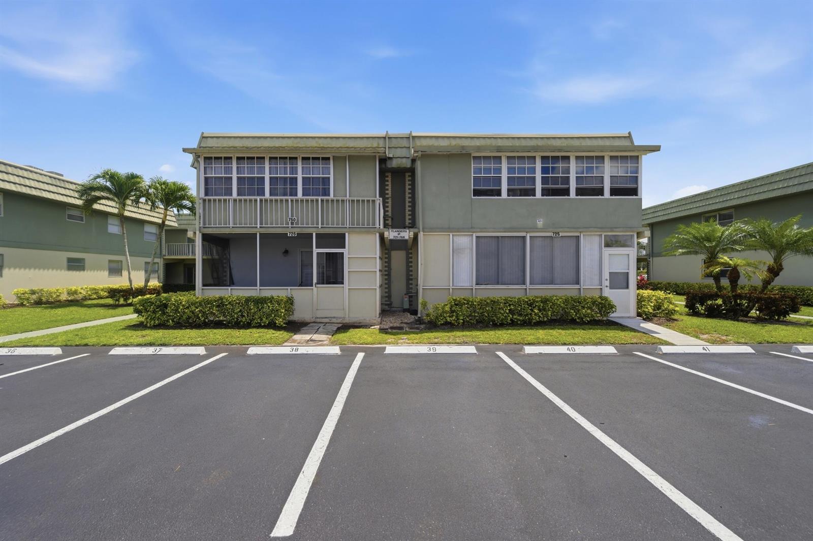 A two-story apartment building with a parking lot in the foreground — 724 Flanders P, Delray Beach FL 33484, DELRAY BEACH, FL