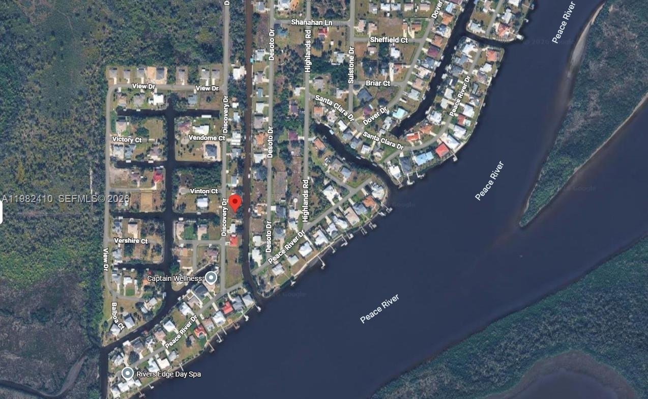 This is a satellite map view of a residential neighborhood along the Peace River — 3502 DISCOVERY  DR, Punta Gorda FL 33983, PUNTA GORDA, FL
