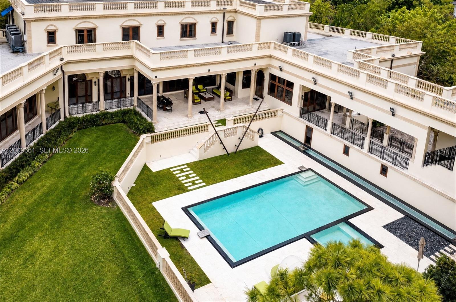 An aerial view of a large mansion with a swimming pool and landscaped courtyard — 5801 Moss Ranch Rd, Pinecrest FL 33156, PINECREST, FL