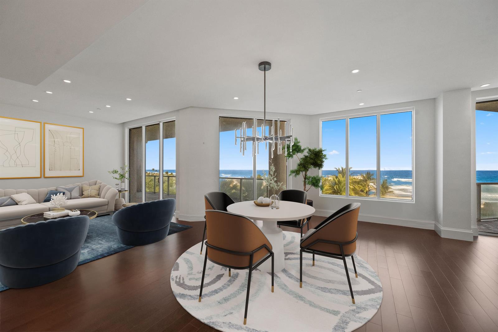 A modern living and dining area with ocean views, dark wood floors, and contemporary furniture — 3000 S Ocean Boulevard, Palm Beach FL 33480, PALM BEACH, FL