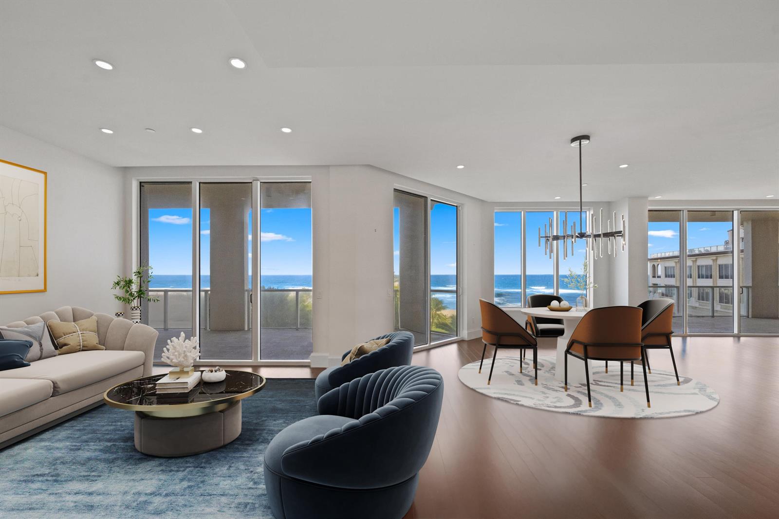 A modern living and dining area with ocean views, hardwood floors, and contemporary furniture — 3000 S Ocean Boulevard, Palm Beach FL 33480, PALM BEACH, FL