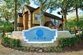 A blue sign with the word Azur stands in front of a multi-story apartment building — 6368 RALEIGH STREET UNIT 1803, ORLANDO, FL