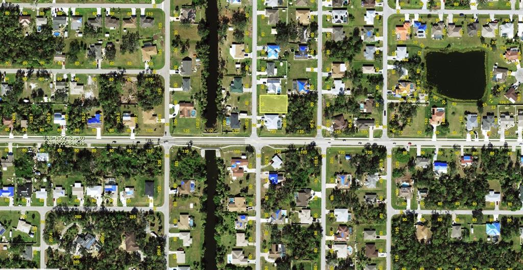 This is an aerial map view of a residential neighborhood with a highlighted vacant lot — 520 KENSINGTON STREET, PORT CHARLOTTE, FL