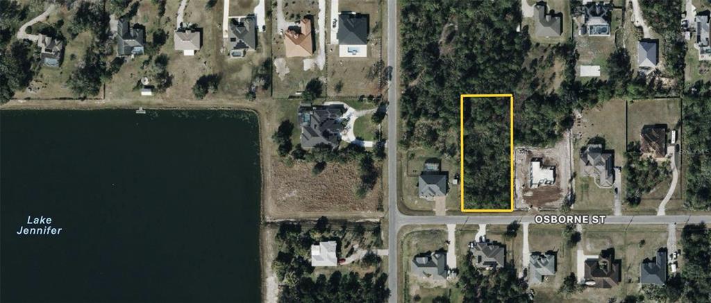An aerial view shows a rectangular vacant lot outlined in yellow on a residential street — OSBORNE STREET, ORLANDO, FL