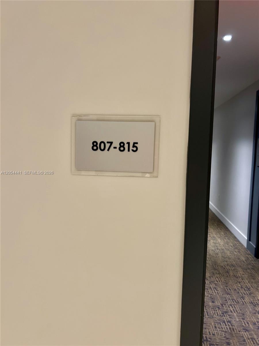 A hallway sign indicates the direction for units 807 through 815 — 1600 SW 1st Ave # 812, Miami FL 33129, MIAMI, FL