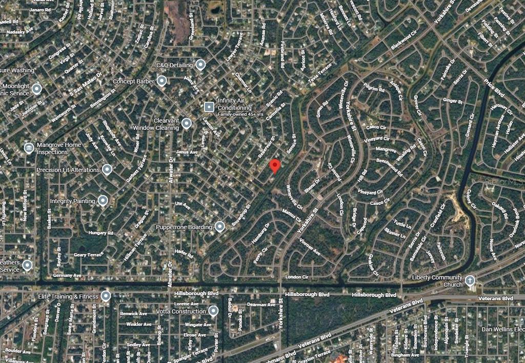 This is an aerial map view of a residential neighborhood with a red location marker — Lot 13 SERNICE STREET, NORTH PORT, FL