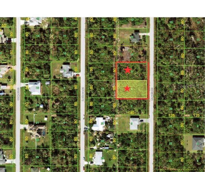 This is an aerial map showing two adjacent vacant lots highlighted with red stars — 6145 REGATTA STREET, PORT CHARLOTTE, FL