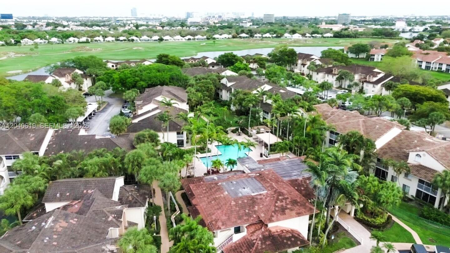 An aerial view shows a residential complex with multiple buildings, a swimming pool, and landscaping — 3204 Glenmoor Dr # 3204, West Palm Beach FL 33409, WEST PALM BEACH, FL