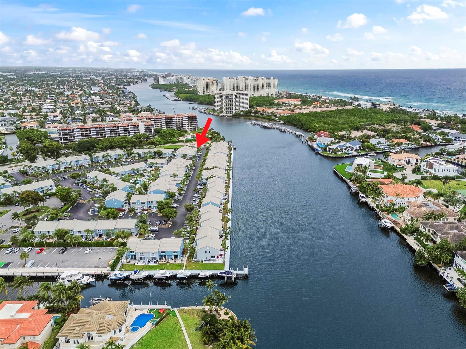 An aerial view shows a waterfront residential complex with a red arrow pointing toward a row of townhomes — 866 E Jeffery Street, Boca Raton FL 33487, BOCA RATON, FL