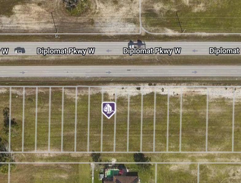 This aerial map shows a vacant residential lot located along a multi-lane road — 348 DIPLOMAT PARKWAY W, CAPE CORAL, FL