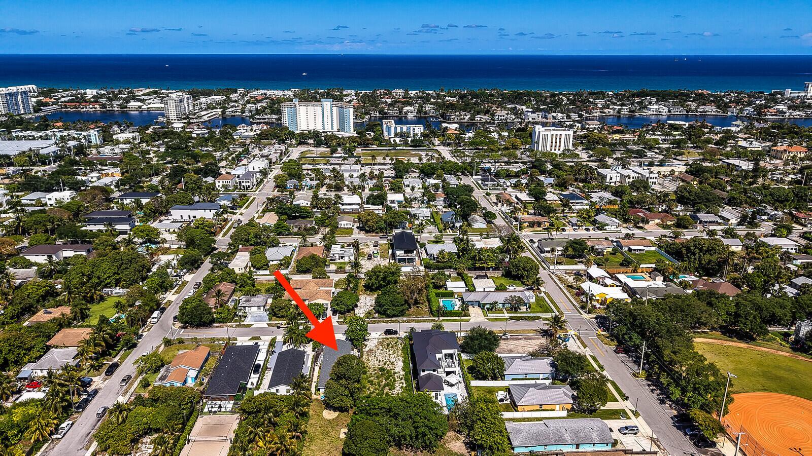 An aerial view shows a residential neighborhood with a red arrow pointing to a house — 610 SE 2nd Avenue, Delray Beach FL 33483, DELRAY BEACH, FL