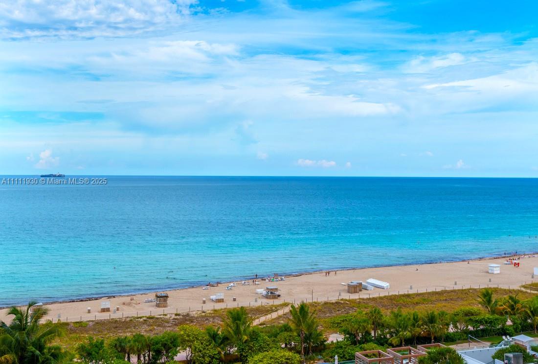 An elevated view of a sandy beach and the ocean under a blue sky — 102 24th St # 1106, Miami Beach FL 33139, MIAMI BEACH, FL