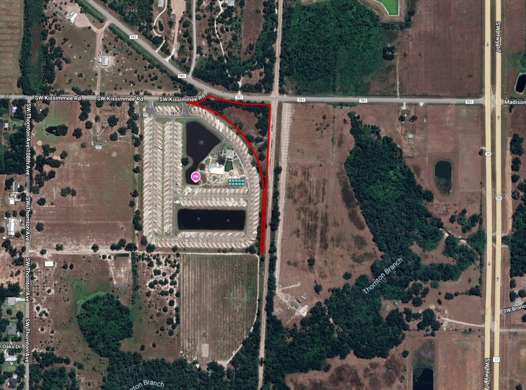 This is an aerial map showing a parcel of land outlined in red near roads — SW CO ROAD 761, ARCADIA, FL