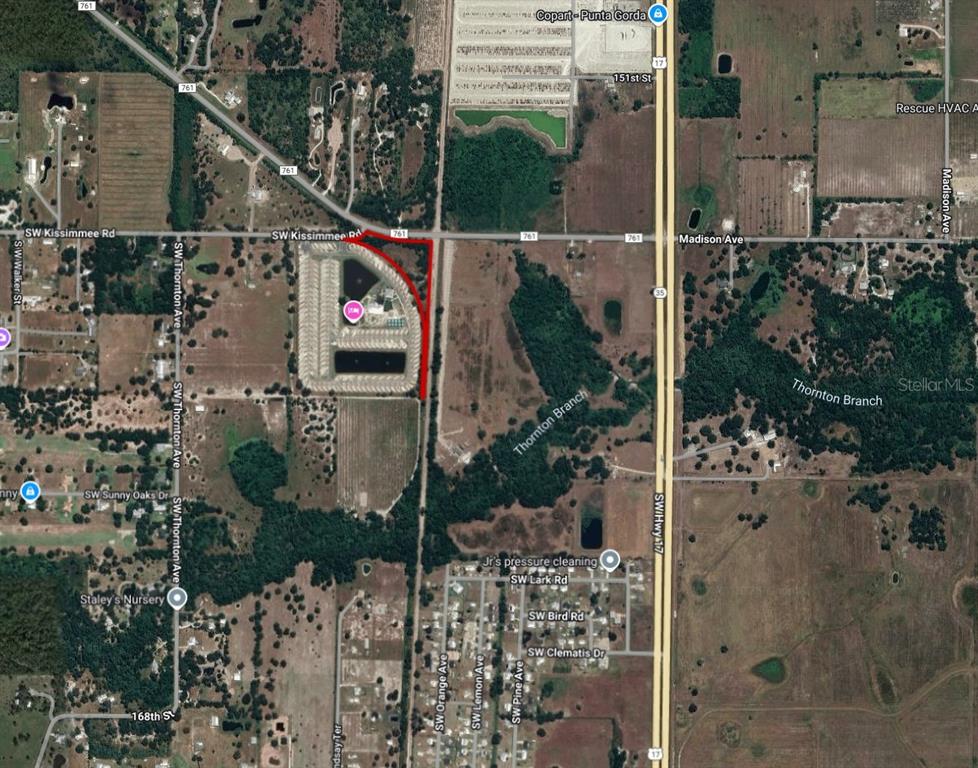 This is an aerial map showing a parcel of land outlined in red near a road — SW CO ROAD 761, ARCADIA, FL
