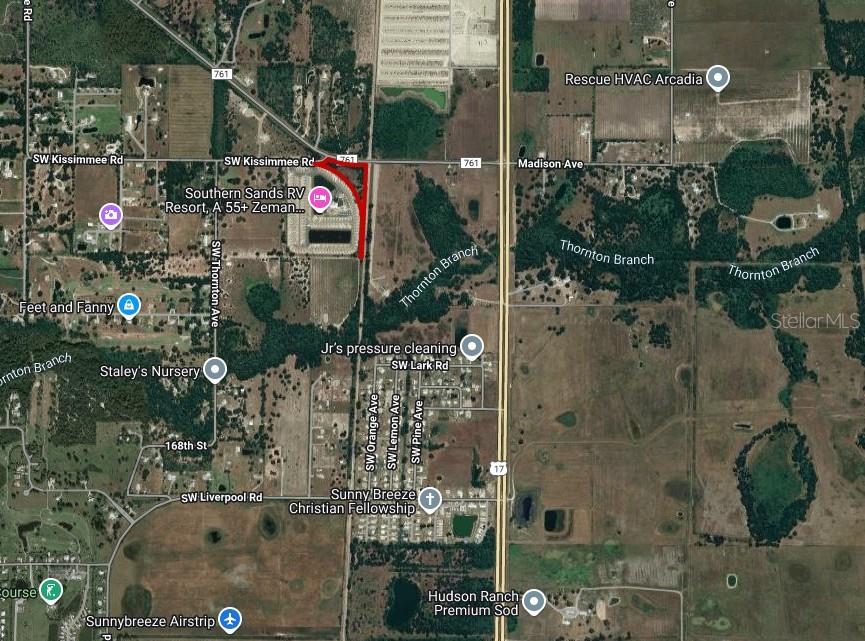 This is a satellite map showing a property outlined in red near a highway intersection — SW CO ROAD 761, ARCADIA, FL