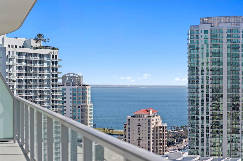 A high-rise balcony overlooks a bay surrounded by several tall apartment buildings — 400 CENTRAL AVENUE UNIT 2806, ST PETERSBURG, FL