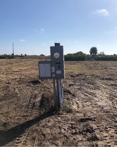 An electrical meter pedestal stands in the middle of a cleared, dirt-covered vacant lot — 29800 NW 192nd Avenue, Okeechobee FL 34972, OKEECHOBEE, FL