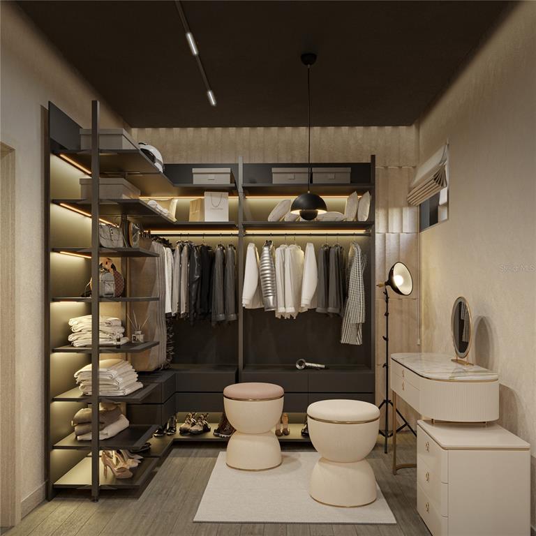 A rendering of a modern walk-in closet featuring dark shelving, hanging clothes, and vanity furniture — 2861 DON QUIXOTE DRIVE, PUNTA GORDA, FL