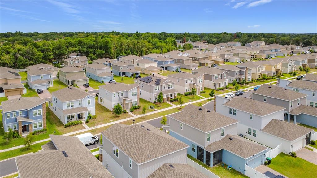 An aerial view of a suburban neighborhood featuring numerous single-family homes with pitched roofs — 2195 SWEET HONEY LANE, APOPKA, FL