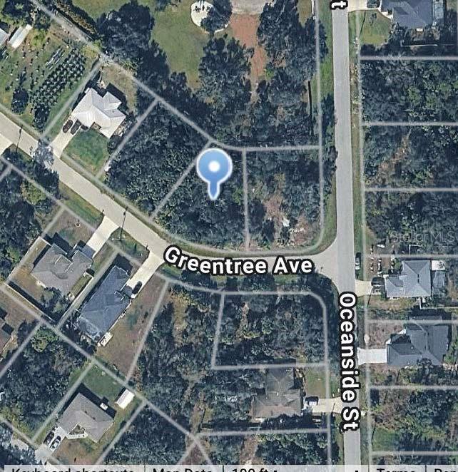 This is an aerial map view of a vacant residential lot located at a street intersection — GREENTREE AVENUE, NORTH PORT, FL