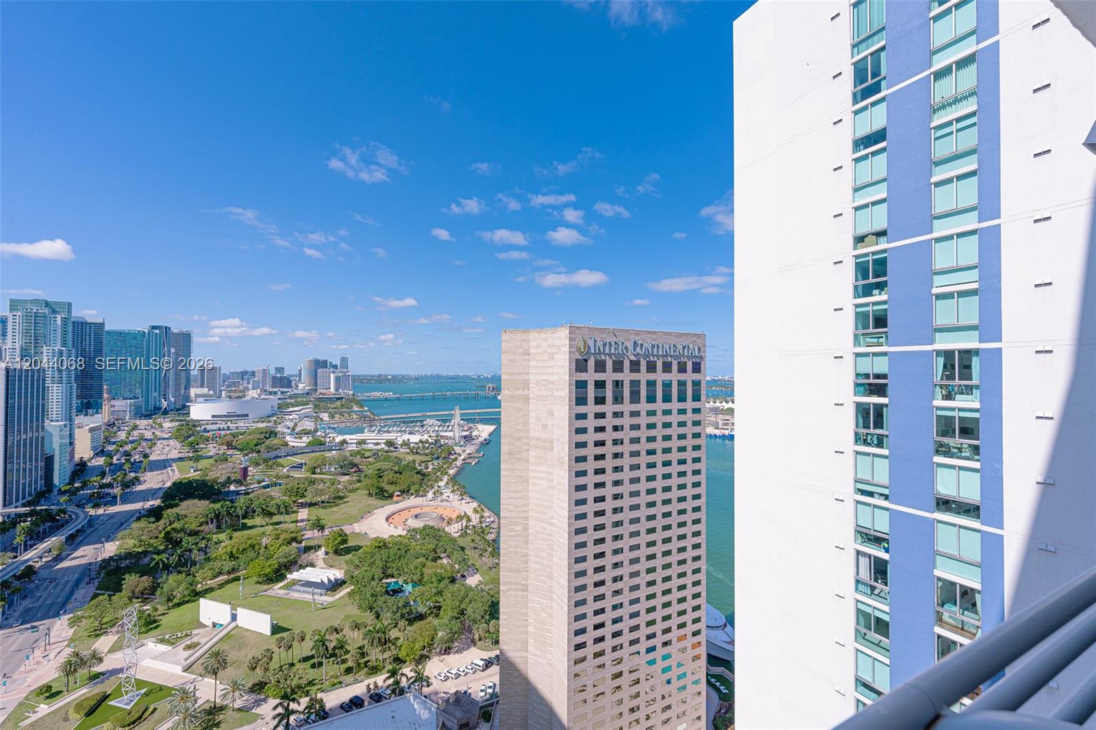 An elevated view shows a park, the InterContinental hotel, and a neighboring high-rise building — 325 S Biscayne Blvd # 3624, Miami FL 33131, MIAMI, FL