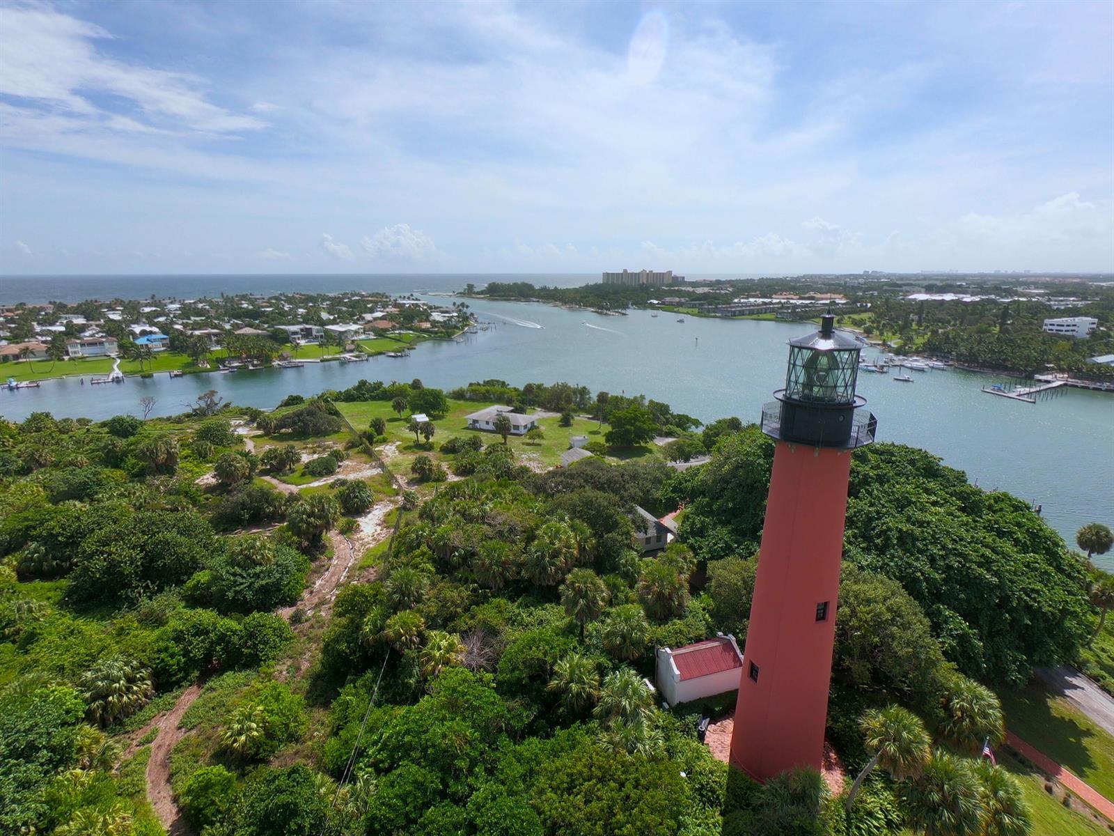 An aerial view of the Jupiter Inlet Lighthouse surrounded by lush trees and coastal waterways — 2531 25th Court, Jupiter FL 33477, JUPITER, FL