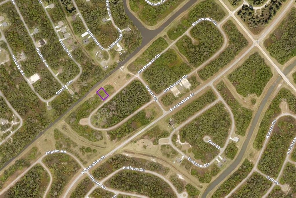 This is an aerial map showing a vacant lot highlighted in purple within a residential neighborhood — 1134209220 BLACKWOOD CIRCLE, NORTH PORT, FL