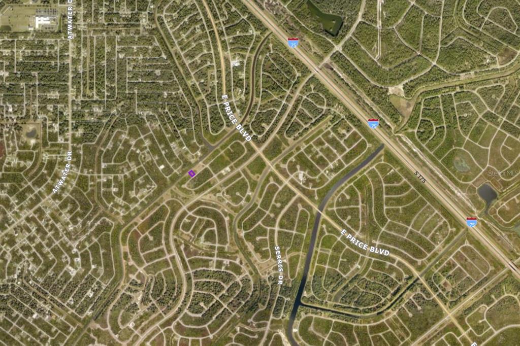 This is an aerial map view of a residential neighborhood near a highway — 1134209220 BLACKWOOD CIRCLE, NORTH PORT, FL