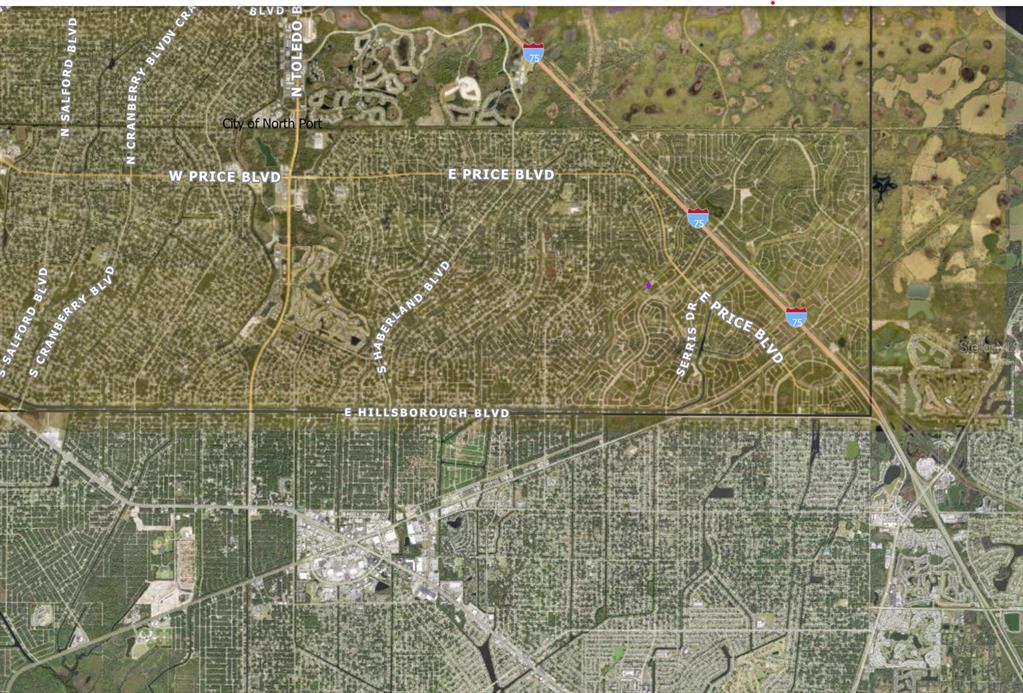 This is an aerial map showing the street layout and highway proximity in North Port — 1134209220 BLACKWOOD CIRCLE, NORTH PORT, FL