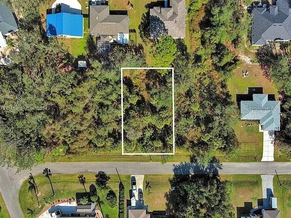 An aerial view shows a rectangular vacant lot outlined in white within a residential neighborhood — SARGON AVENUE, NORTH PORT, FL