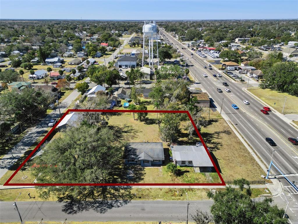 An aerial view shows a residential lot with two buildings outlined in red — 1322 NEW YORK AVENUE, ST CLOUD, FL
