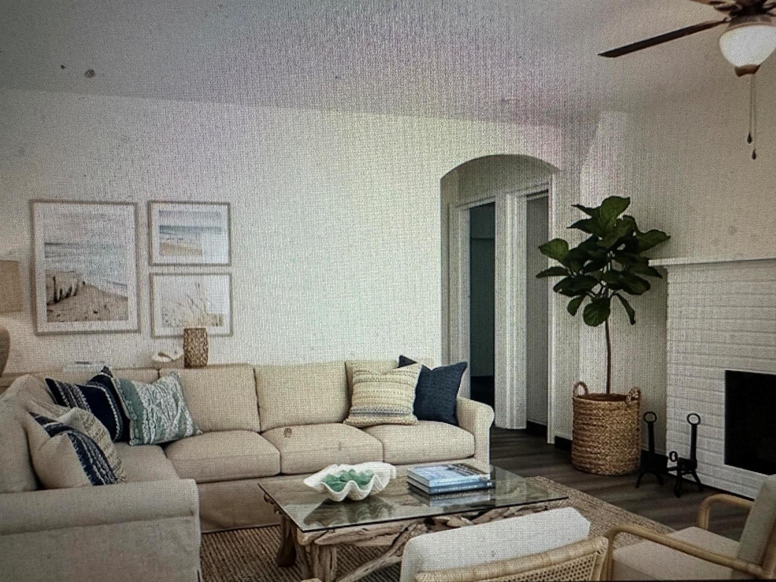 A living room features a beige sectional sofa, a glass coffee table, and a potted plant — 84 E North Shore Avenue, FL 33917, FL