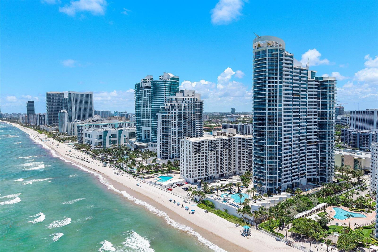 An aerial view of high-rise residential buildings along a sandy beach and the ocean — 3101 S Ocean Drive # 2707, Hollywood FL 33019, HOLLYWOOD, FL