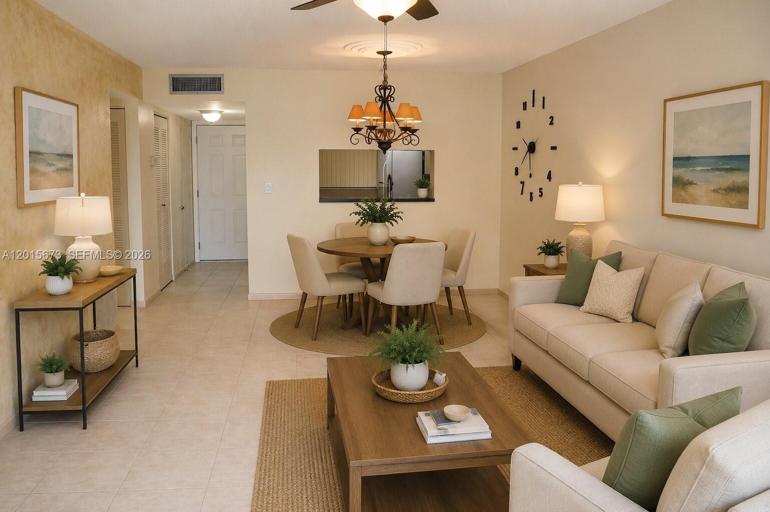 A furnished living and dining area features tile floors, a neutral color palette, and decor — 10855 SW 112th Ave # 309, Miami FL 33176, MIAMI, FL