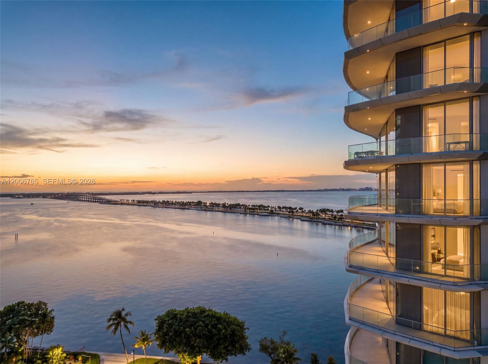 A high-rise building overlooks a bridge and water at sunset — 175 SE 25th Rd # 604, Miami FL 33129, MIAMI, FL