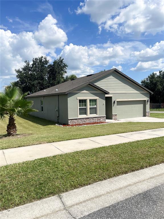 15725 PINE SISKIN LOOP, MASCOTTE, FL — photo 2 of 17