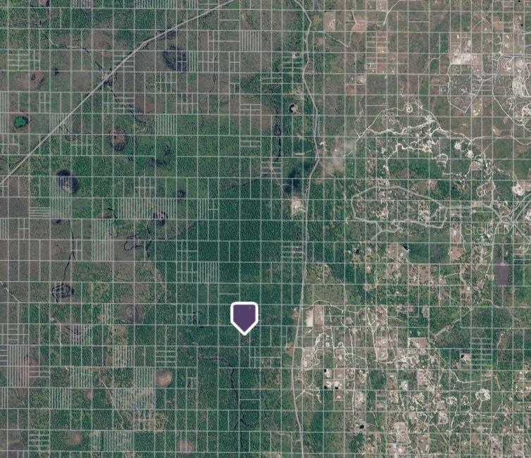 This is an aerial map view showing a plot of land marked with a pin — HWY 60, FROSTPROOF, FL