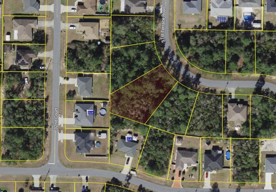 This is an aerial map showing a vacant residential lot surrounded by houses and streets — SW 31ST TERRACE ROAD, OCALA, FL