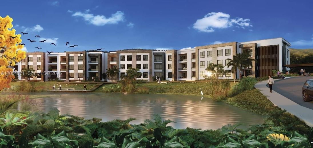 This architectural rendering shows a modern multi-story apartment complex overlooking a pond and landscaping — KM 1 Lagos de Iraka Suites & HomeSuite # 103, co 9999, co