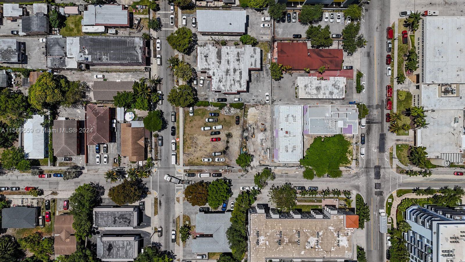 This aerial view shows a city block with various buildings, parking lots, and streets — 1111 NW 6th St, Miami FL 33136, MIAMI, FL