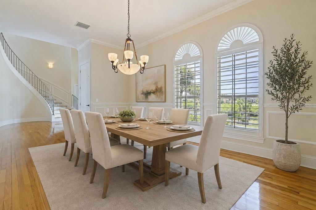 An aerial view shows a multi-story house situated on a waterfront lot with mangroves — 4631 HARBORPOINTE DRIVE, PORT RICHEY, FL