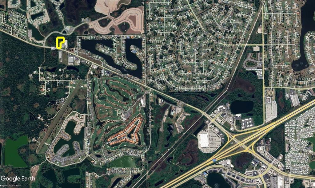This is an aerial map view of a residential area with a golf course — 12280 SW COUNTY ROAD 769, LAKE SUZY, FL