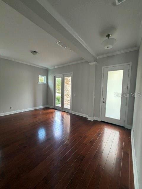 An empty room with dark hardwood floors, a glass door, and French doors leading outside — 8001 NEMOURS PARKWAY, ORLANDO, FL