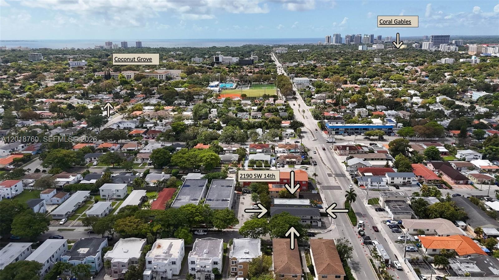 An aerial view shows a multi-unit residential building surrounded by neighborhood streets and trees — 2190 SW 14th Ter, Miami FL 33145, MIAMI, FL